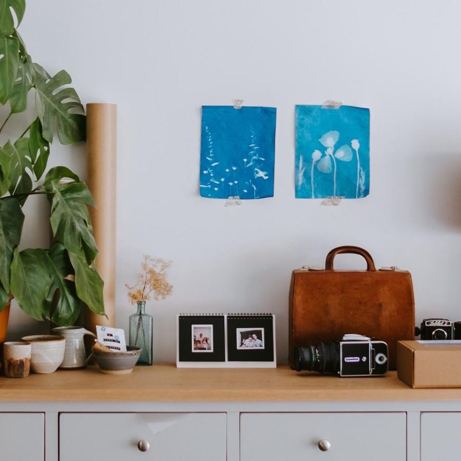 large dresser with a variety of decor on it